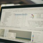 Laptop screen displaying performance data and charts representing website speed optimization